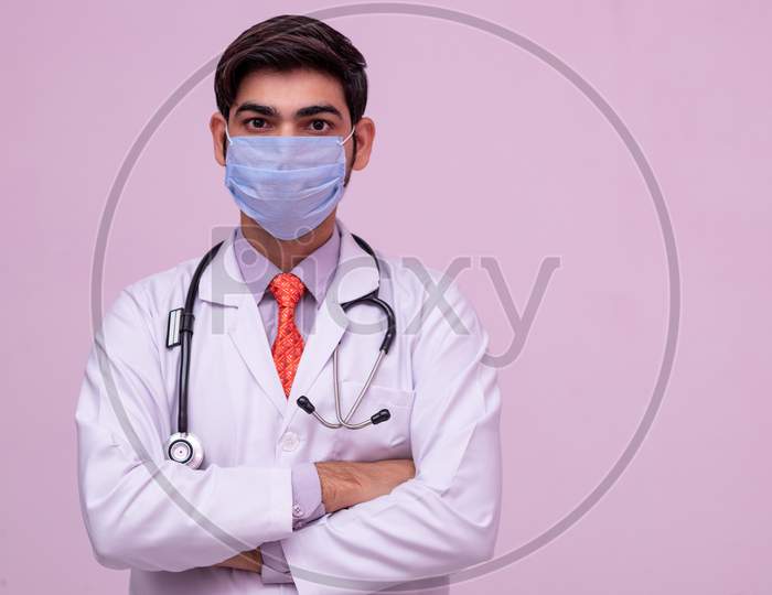 Doctor Wearing Medical Mask On Isolated Background.