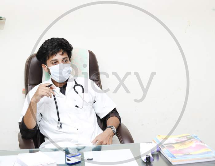 Handsome Indian/asian Doctor or physician with stethoscope, uniform