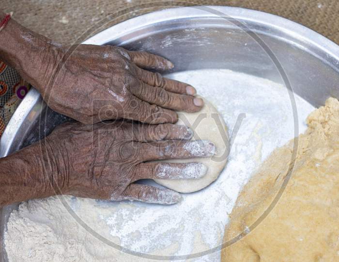 Senior Woman Hand Making Chapati.