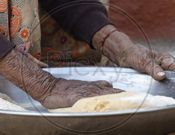 Senior Woman Hand Making Roti