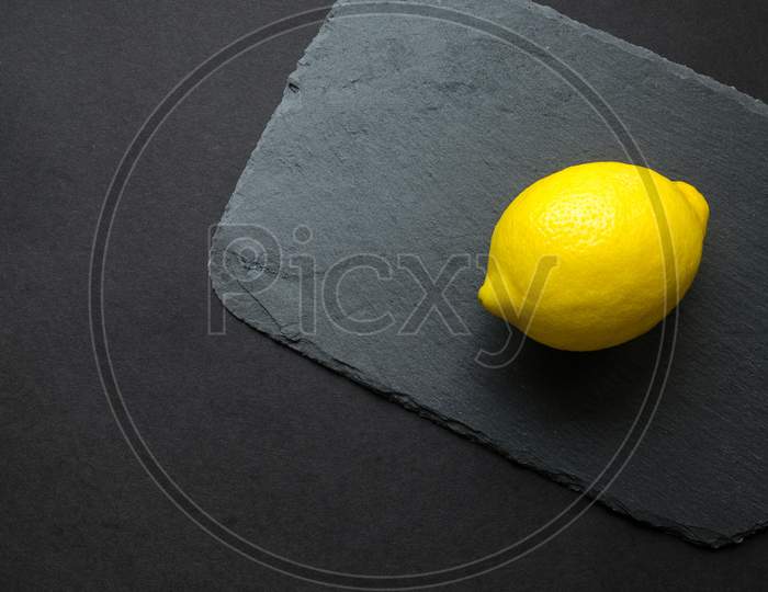 Isolated lemon on dark background