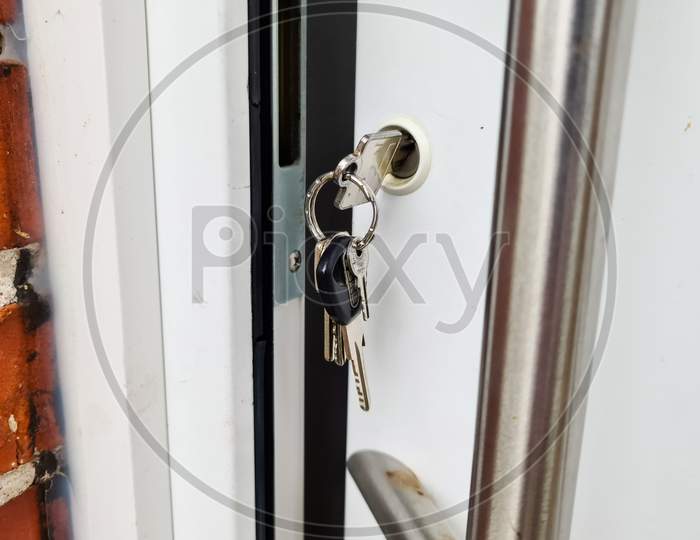 Open Apartment Door With A Key In The Lock - Security And Protection Against Burglary.
