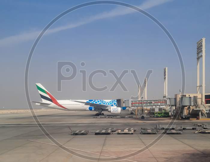 Emirates Airlines standing at Sharjah Airport.