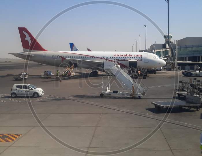 Air Arabia flight is parked at Dammam airport.