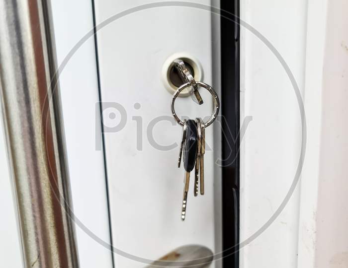 Open Apartment Door With A Key In The Lock - Security And Protection Against Burglary.