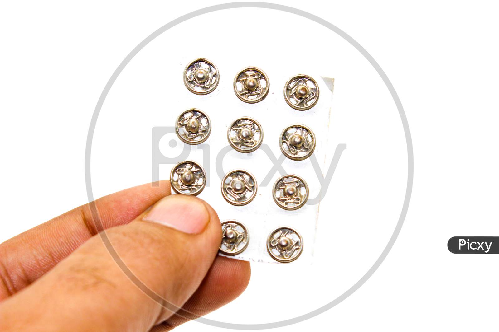 Steel Buttons On White Background With Selective Focus