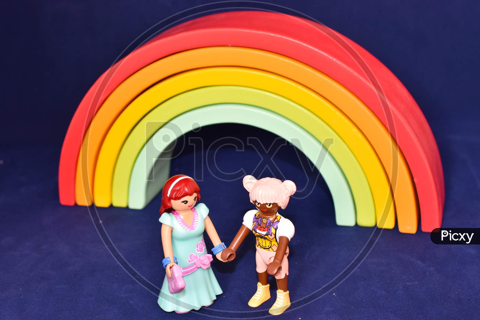 Vaduz, Liechtenstein, October 15, 2021 Human Toy Lesbian Pair In Front Of A Rainbow
