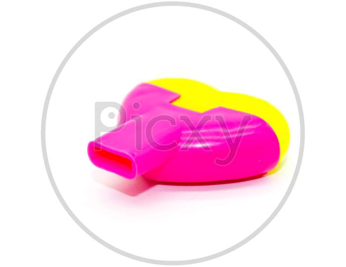 Toy Whistle On White Background With Selective Focus