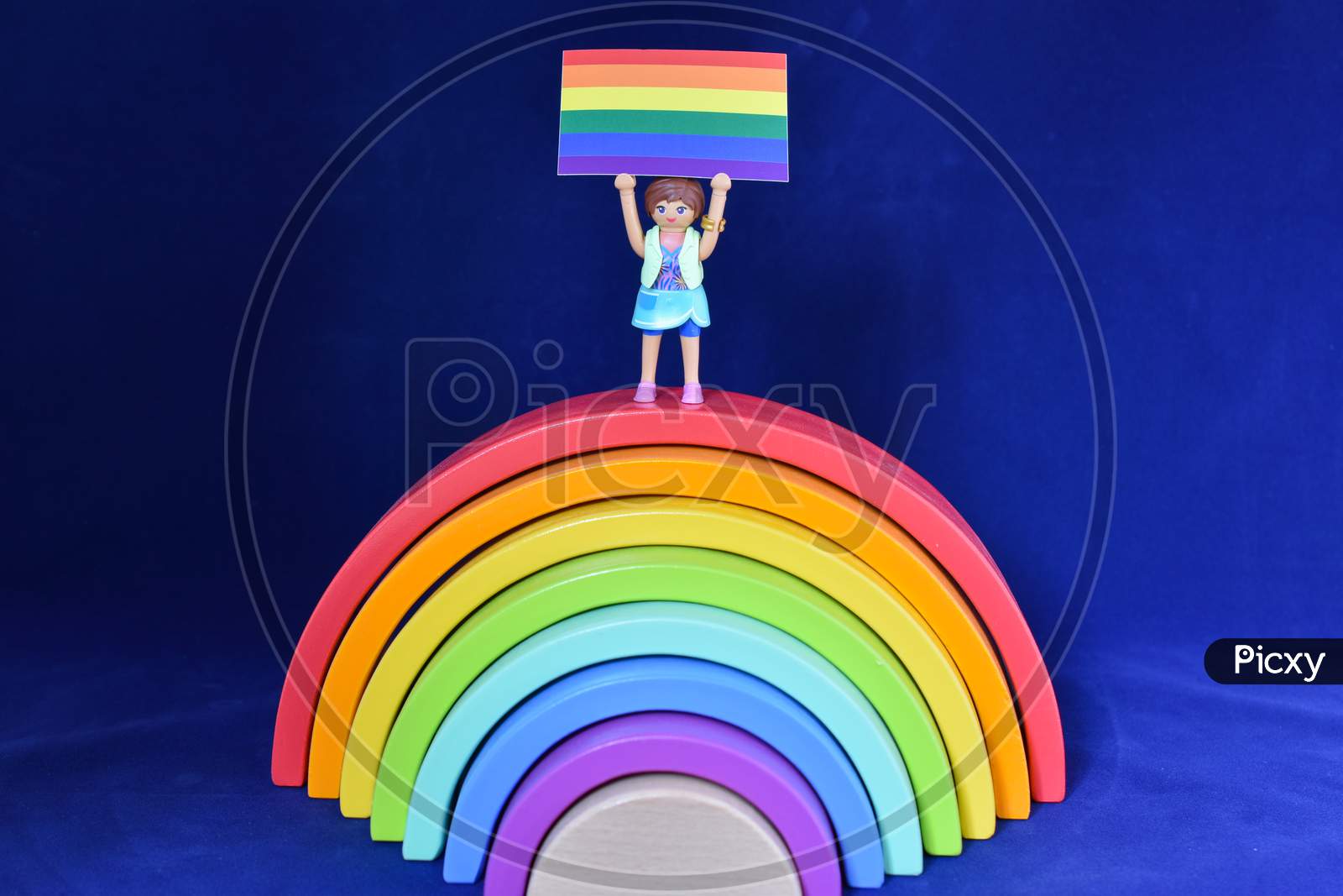 Vaduz, Liechtenstein, October 15, 2021 Human Toy With A Gender Flag On A Rainbow