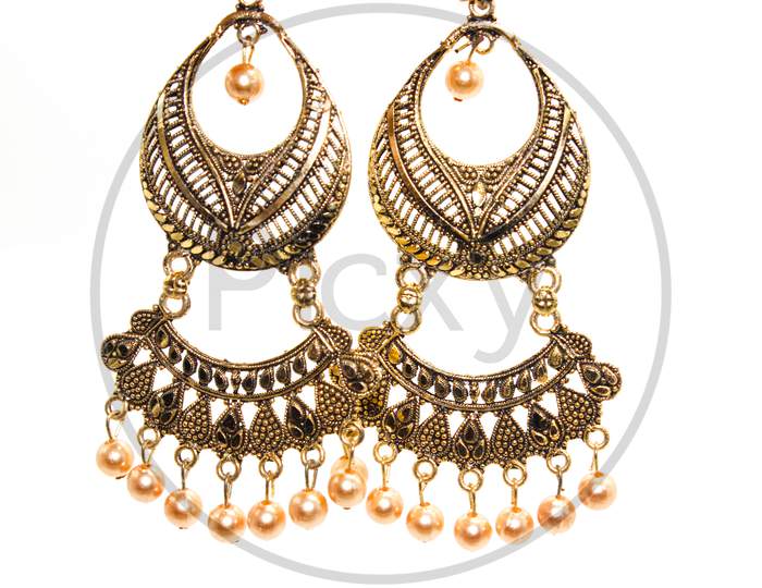 Earrings On White Background With Selective Focus