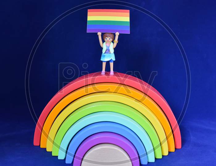 Vaduz, Liechtenstein, October 15, 2021 Human Toy With A Gender Flag On A Rainbow