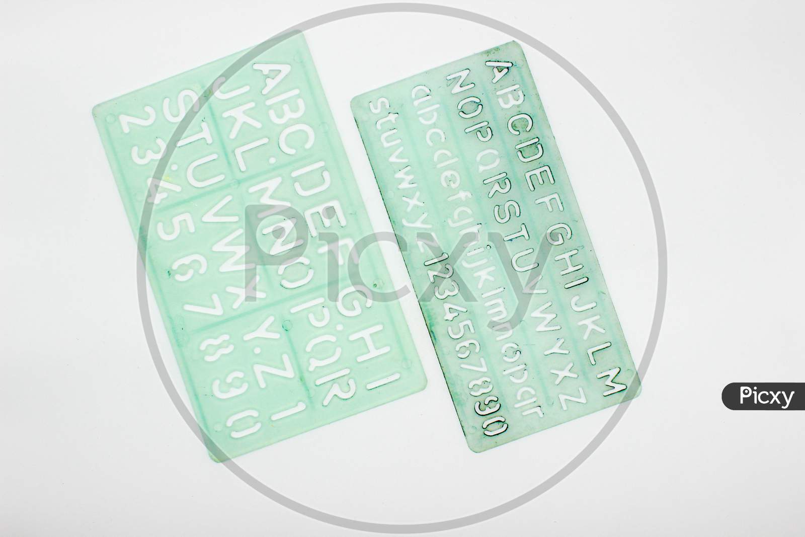 Alphabet Stencils Isolated On White Background With Selective Focus