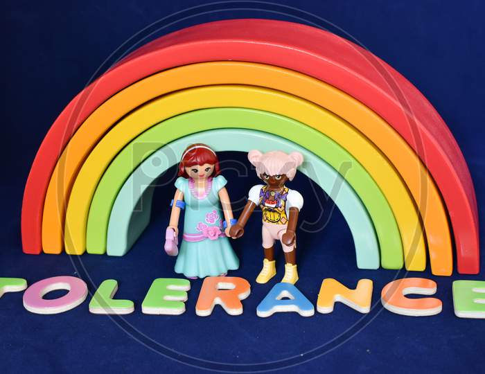 Vaduz, Liechtenstein, October 15, 2021 Lesbian Human Toy Pair In Front Of A Rainbow