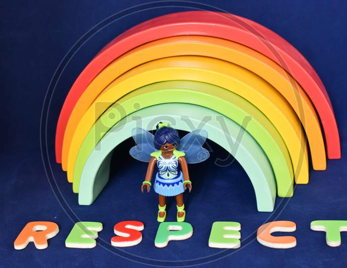 Vaduz, Liechtenstein, October 15, 2021 Black Human Toy And The Word Respect In Front Of A Rainbow