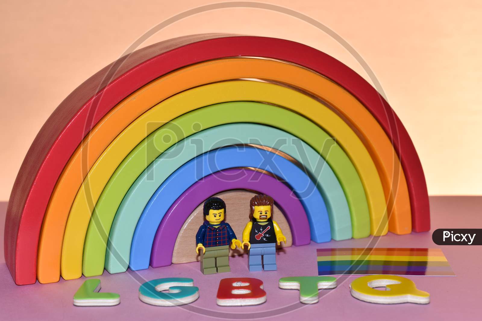 Vaduz, Liechtenstein, October 17, 2021 Human Toy Gay Pair In Front Of A Rainbow