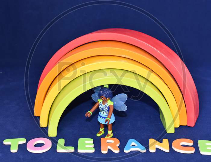 Vaduz, Liechtenstein, October 15, 2021 Rainbow With A Black Angel Toy And The Word Tolerance