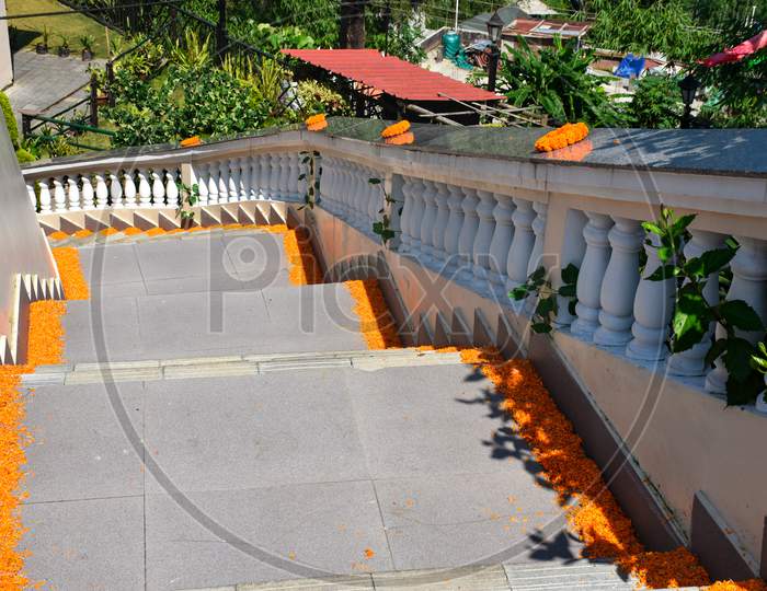 Staircase Decorated With Marigold Flower Leaves.