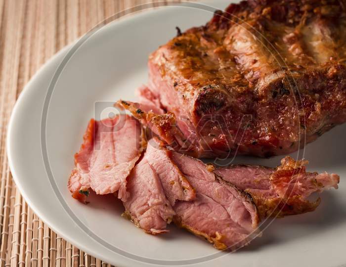 Roasted pork ribs close up