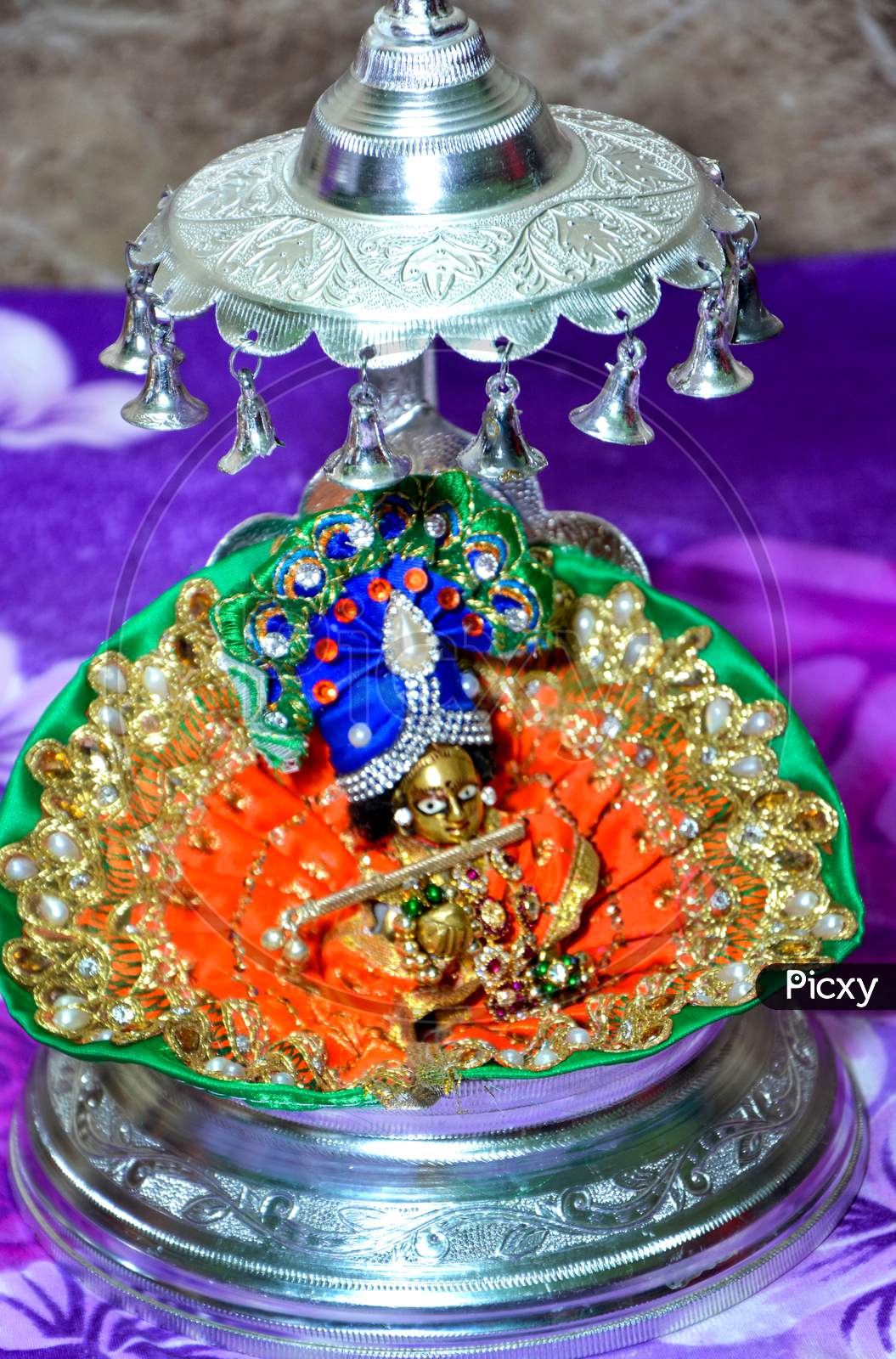 Lord Krishna Also Known As Laddu Gopal Sculpture In Beautiful Clothes Close Up