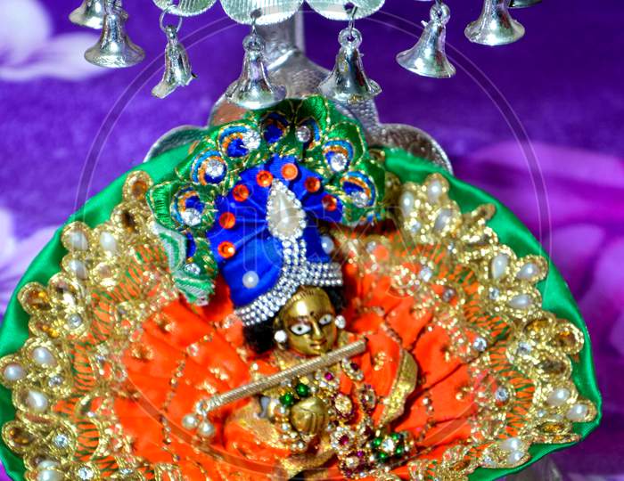 Lord Krishna Also Known As Laddu Gopal Sculpture In Beautiful Clothes Close Up