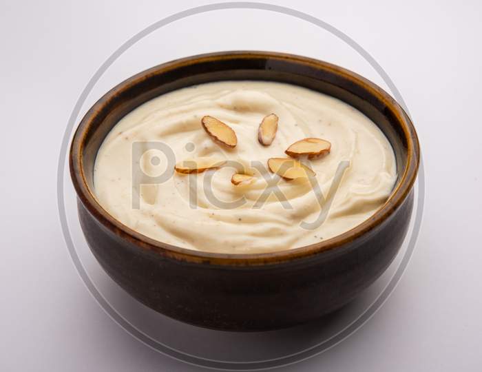 Shrikhand Is An Indian Sweet Dish Made Of Strained Yogurt, Garnished With Dry Fruits