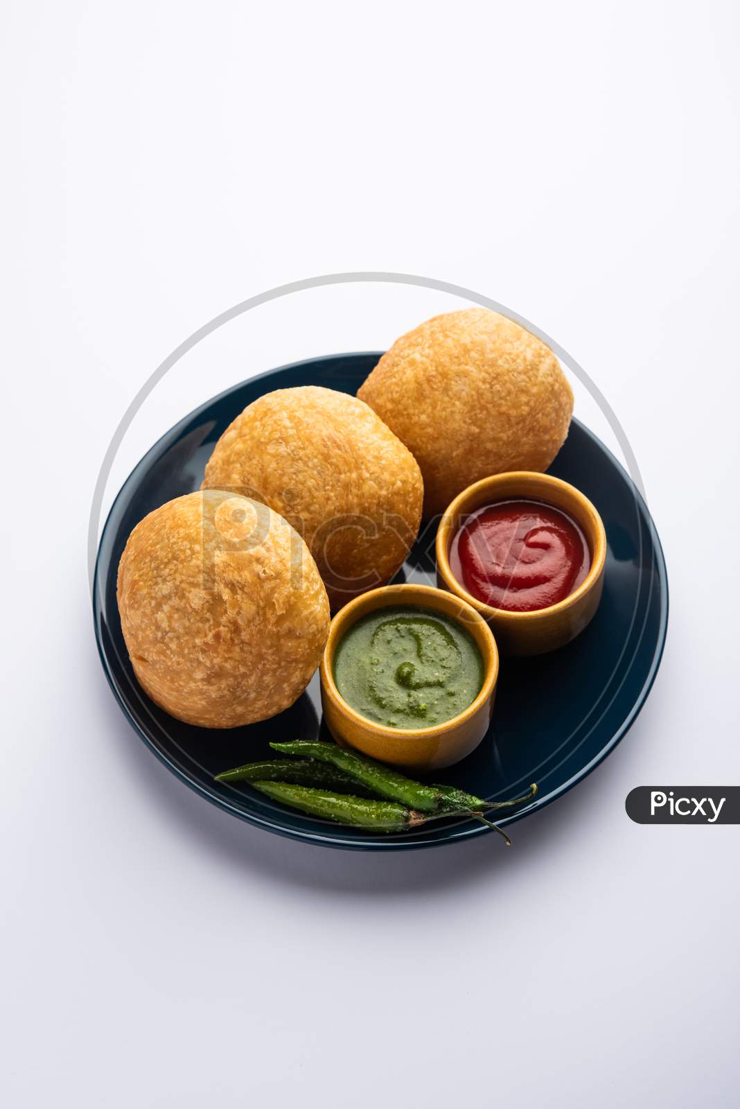 Kachori Is A Flat Spicy Snack From India Also Spelled As Kachauri And Kachodi. Served With Tomato Ketchup. Selective Focus