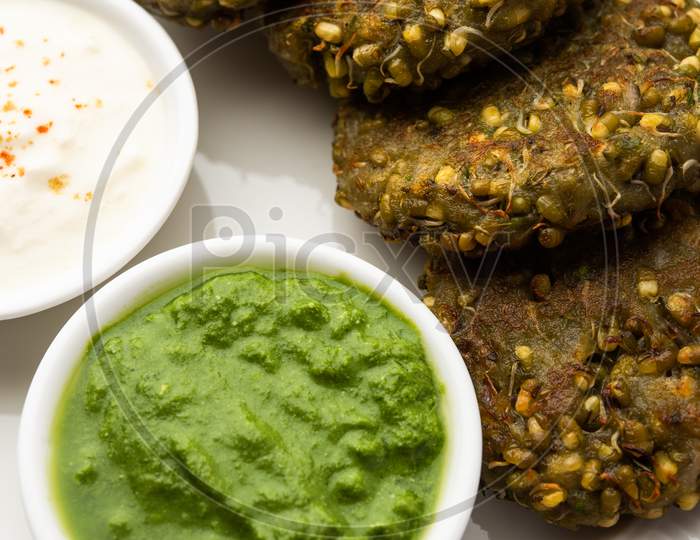 Sprouted Moong Dal Tikki Or Patties Is A Healthy Snack From India Served With Green Chutney And Curd
