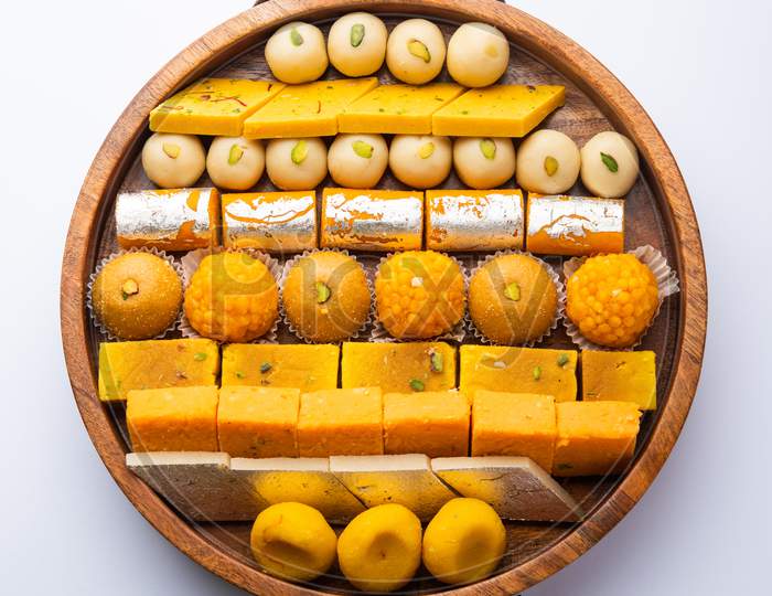 Image of Group Of Indian Assorted Sweets Or Mithai With Diya-IT362697-Picxy