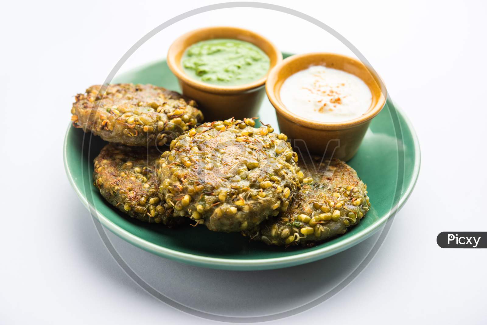 Sprouted Moong Dal Tikki Or Patties Is A Healthy Snack From India Served With Green Chutney And Curd