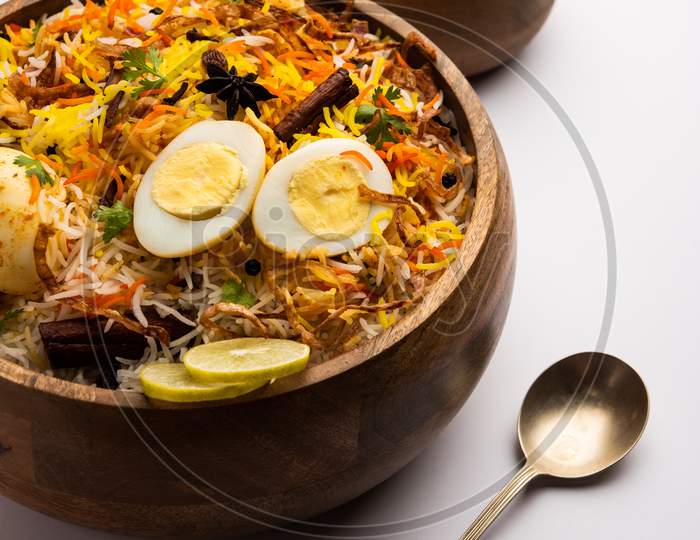 Egg Biryani - Basmati Rice Cooked With Masala Roasted Eggs And Spices And Served With Yogurt, Selective Focus