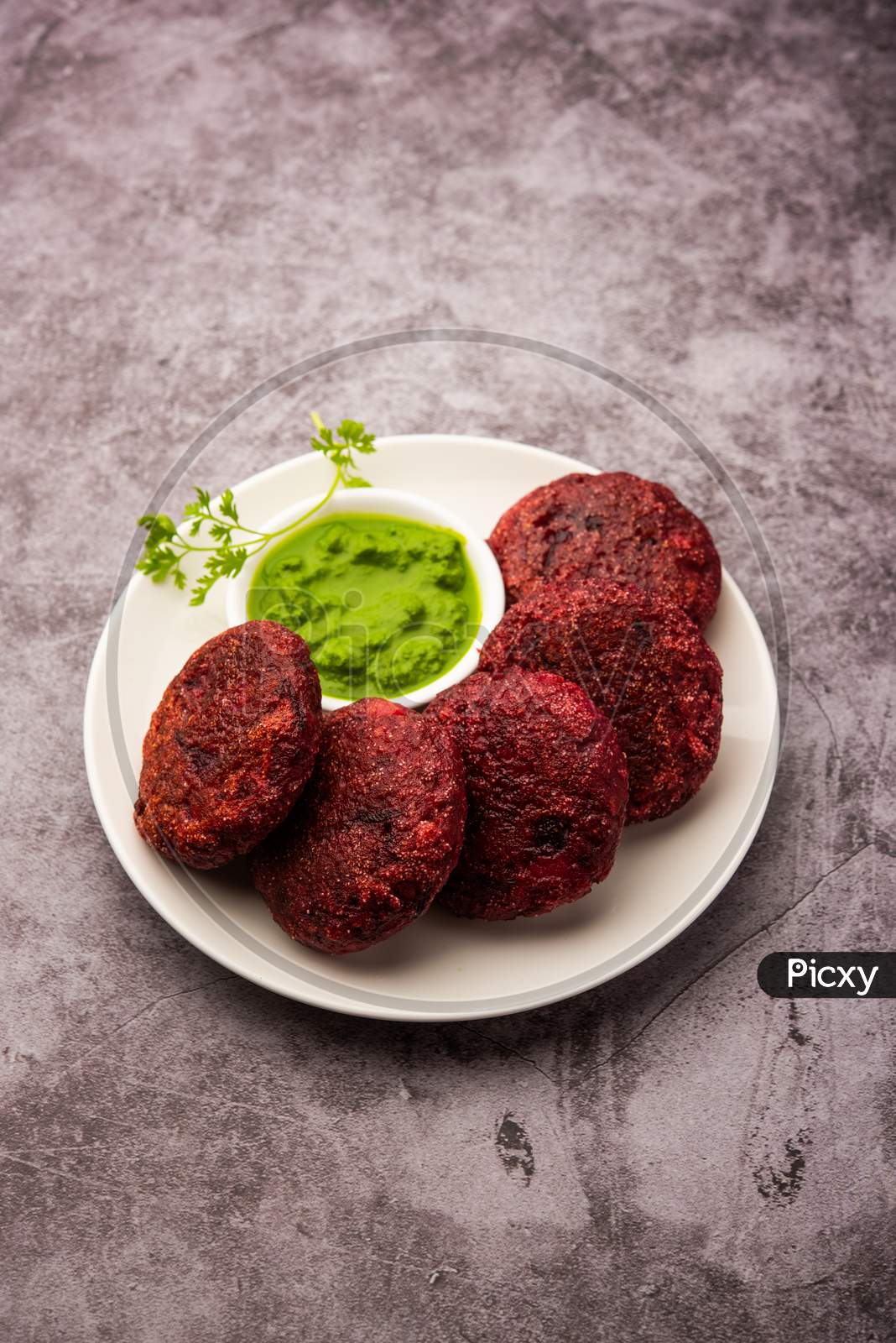 Image of Beet Root Patties Or Cutlet Or Tikki Served With Green Chutney