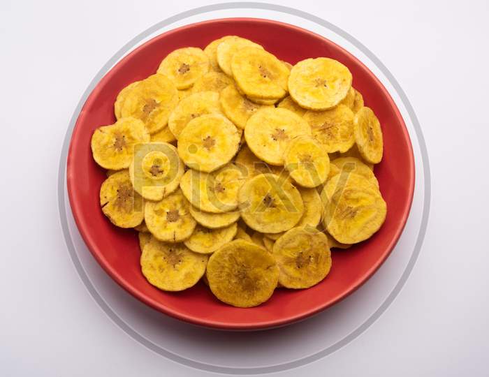 Healthy Homemade Kela Or Banana Chips Or Wafers Served Over Moody Background, Selective Focus