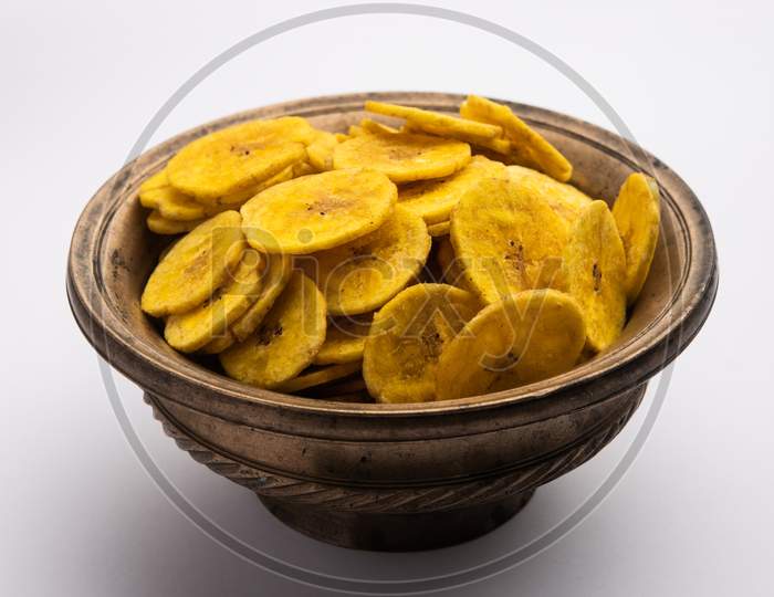 Healthy Homemade Kela Or Banana Chips Or Wafers Served Over Moody Background, Selective Focus