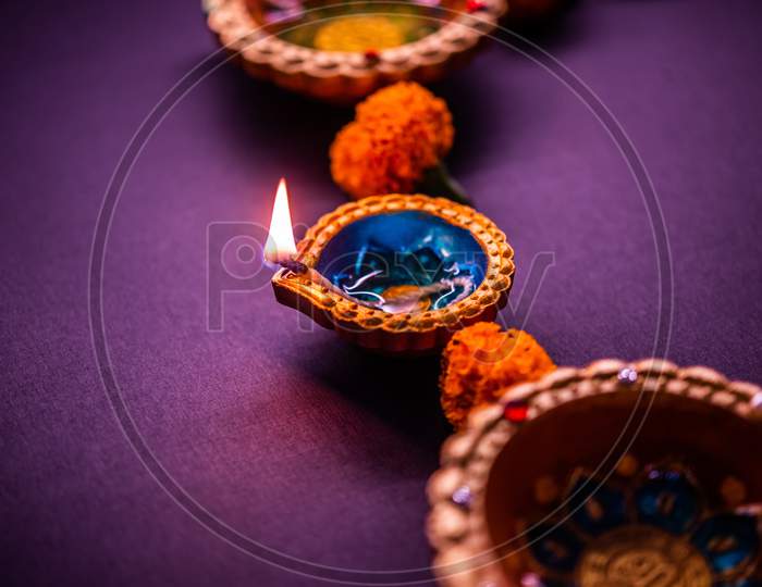 Happy Diwali - Beautiful Diwali Diyas At Night With Flowers