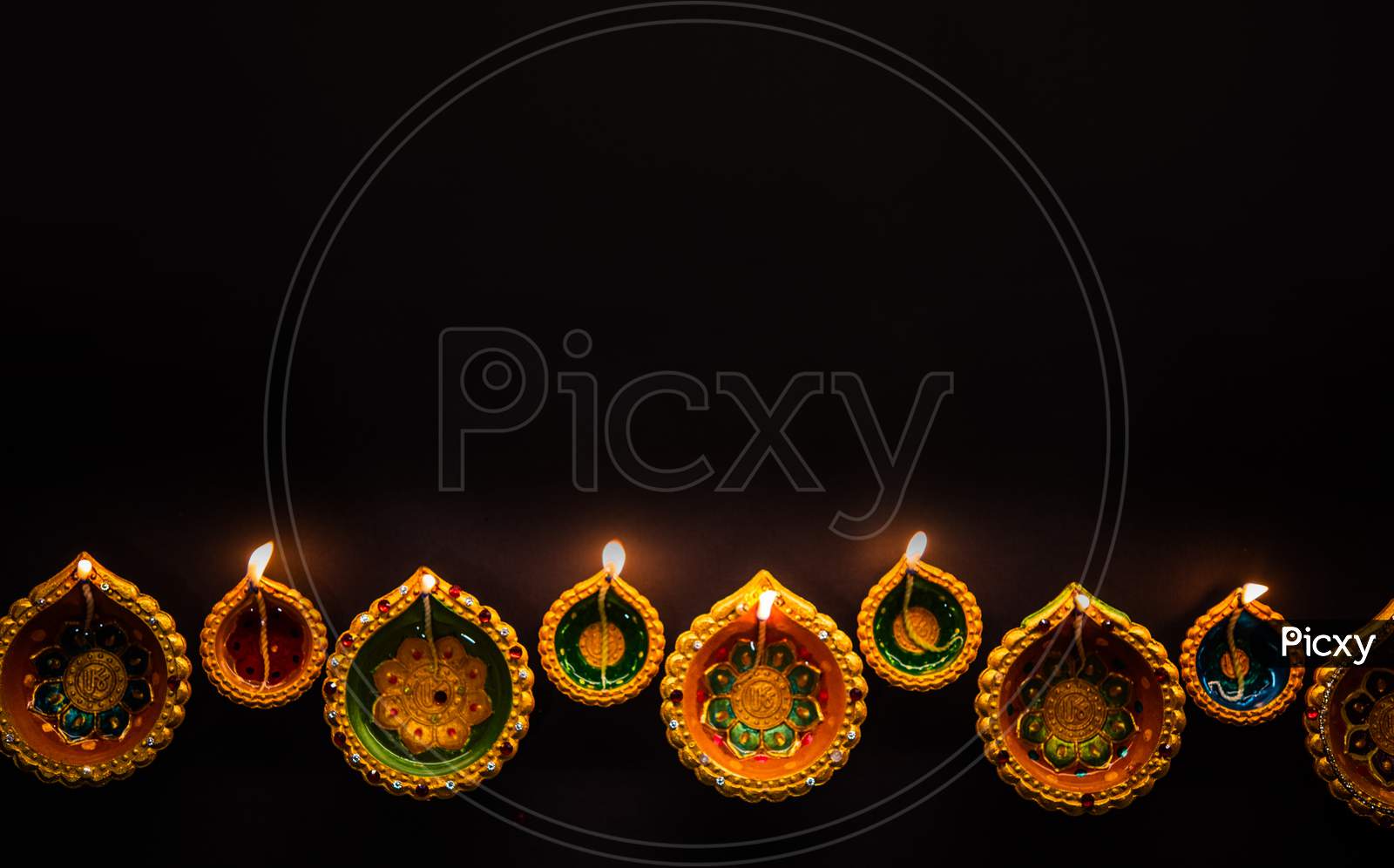 Happy Diwali - Beautiful Diwali Diyas At Night With Flowers