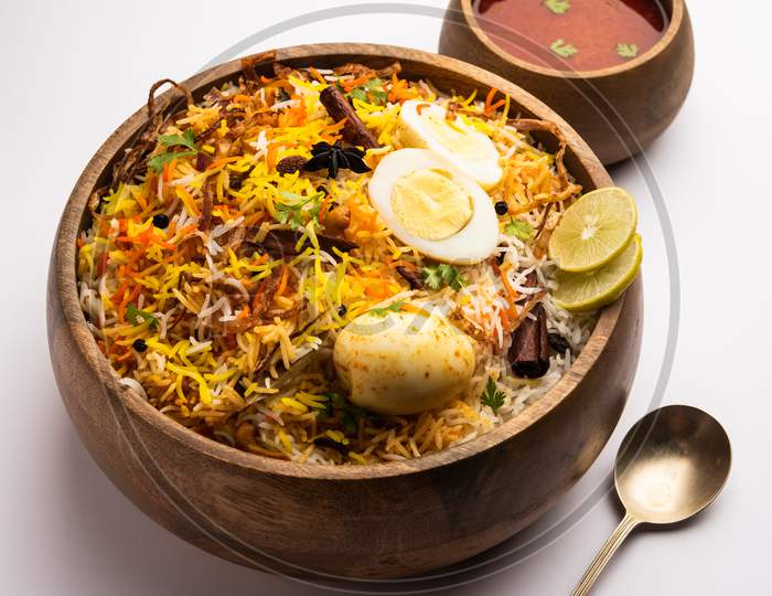 Egg Biryani - Basmati Rice Cooked With Masala Roasted Eggs And Spices And Served With Yogurt, Selective Focus