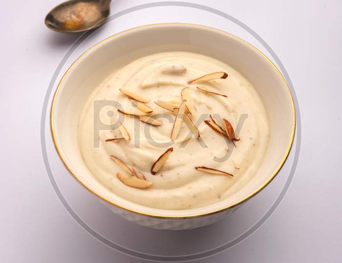 Shrikhand Is An Indian Sweet Dish Made Of Strained Yogurt, Garnished With Dry Fruits
