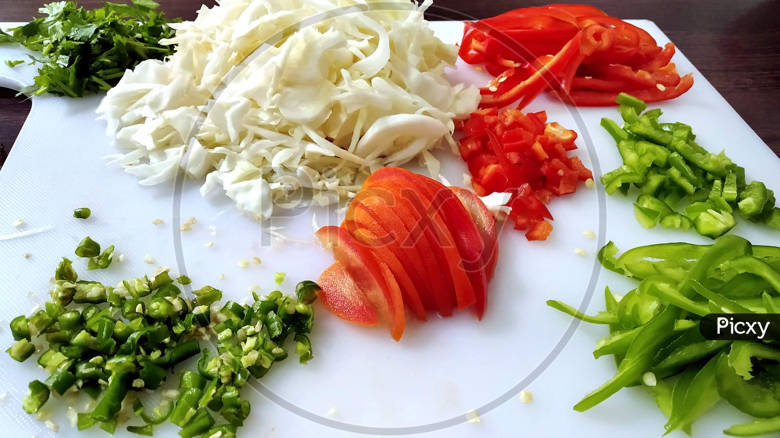 Top View Of Chopped Vegetables On White Chopper