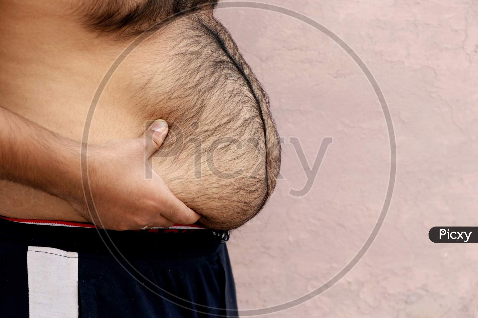 Image of Portrait Of A Asian Fat Man Show Out His Body And Big  Belly.-RV496409-Picxy