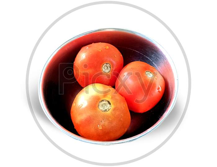 Top View Of Three Ripe Tomatoes In A Steel Bowl On White Background