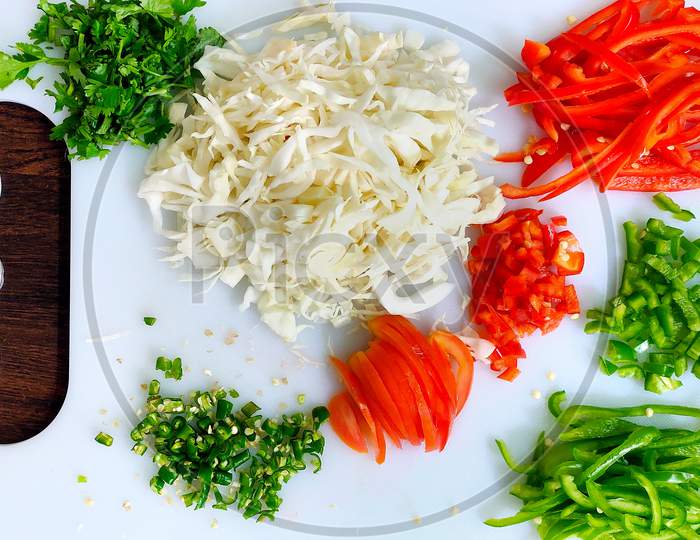 Top View Of Chopped Vegetables On White Chopper