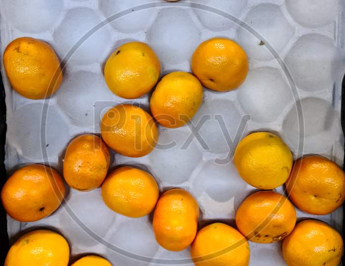 Tangerines On A Cardboard Base In A Supermarket
