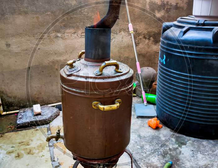 old copper water heater for bath , it's old technique for heating water