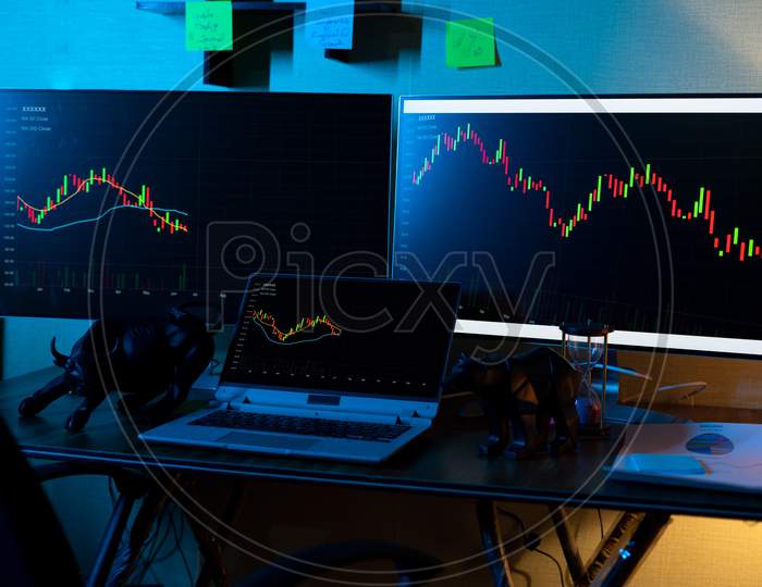 Focus On Laptop Chart, Concept Showing Of Trading Setup With Running Candle Stick Charts Of Stock Market Shares On Monitors For Data Analysis