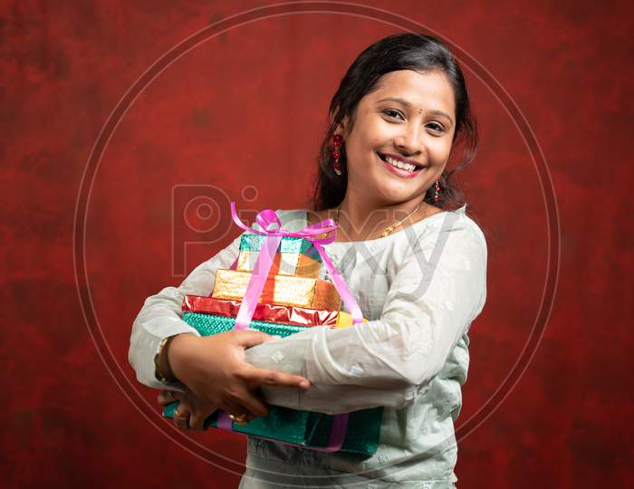 Happy Smiling Indian Woman With Gift Boxes Looking At Camera - Concept Of Gift Present During Festival Holiday Shopping.