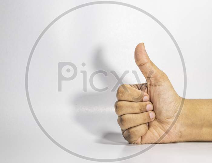 Hand thumbs up gesture with white background