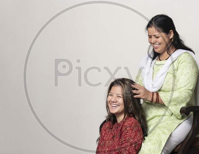 An Indian Girl Getting Her Head Massage By Her Mother, Daughter And Mother Love For Mother'S Day Concept.