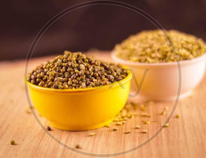 Raw Organic Moong Bean Heap In Yellow Bowl With Selective Focus,Vigna Radiata, Green Beans Or Moong Dal,Dry Organic Moong Whole Dal Or Mung Bean