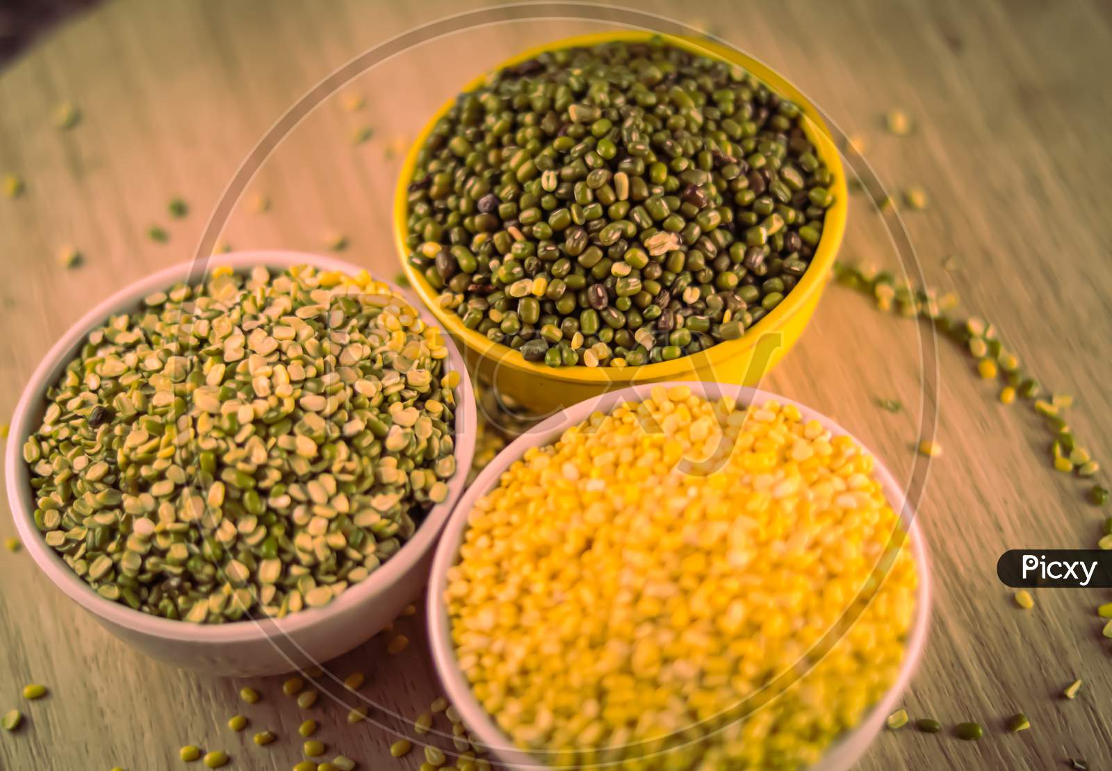 Green And Yellow Moong Mung Dal Lentil Pulse Bean On Black Background, Yellow Mung Dal And Green Moong Bean Rotation On Wooden Table, High Protein Moong Dal