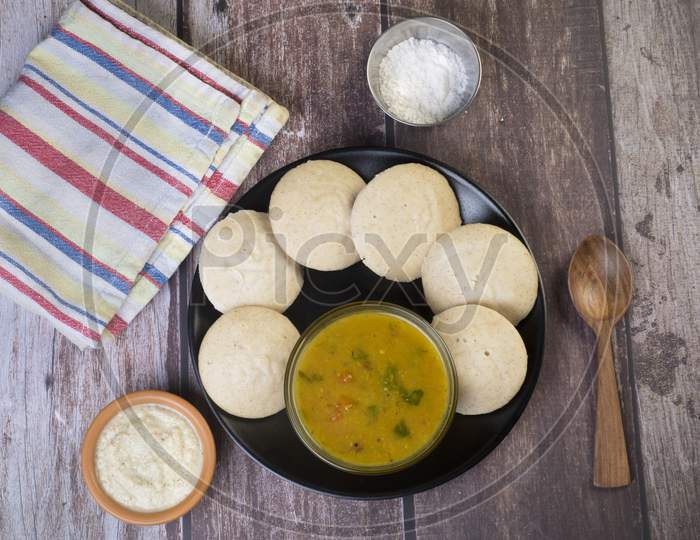 Top View Of Idli Made With Millet Flour Served With Sambhar And Coconut Chutney